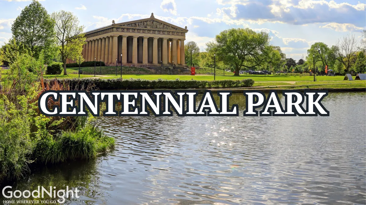 This image showcases Centennial Park with its iconic Parthenon-like structure, a serene pond, and lush greenery. The setting is ideal for group picnics, outdoor relaxation, and community gatherings, all under the open sky.