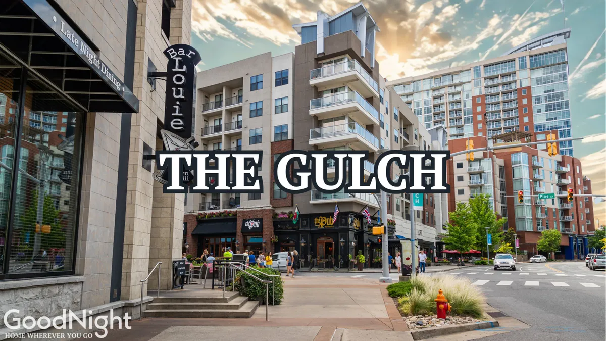 A vibrant view of The Gulch, featuring the Bar Louie sign, surrounding buildings, and a lively street scene. The area bustles with dining, shopping, and socializing—perfect for groups looking to explore Nashville’s trendiest neighborhoods.
